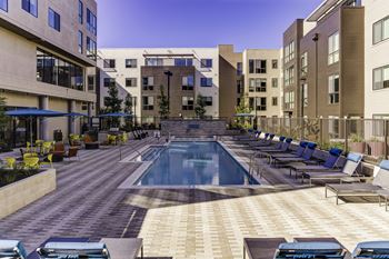 Relaxing resort-style pool with sundeck and spa